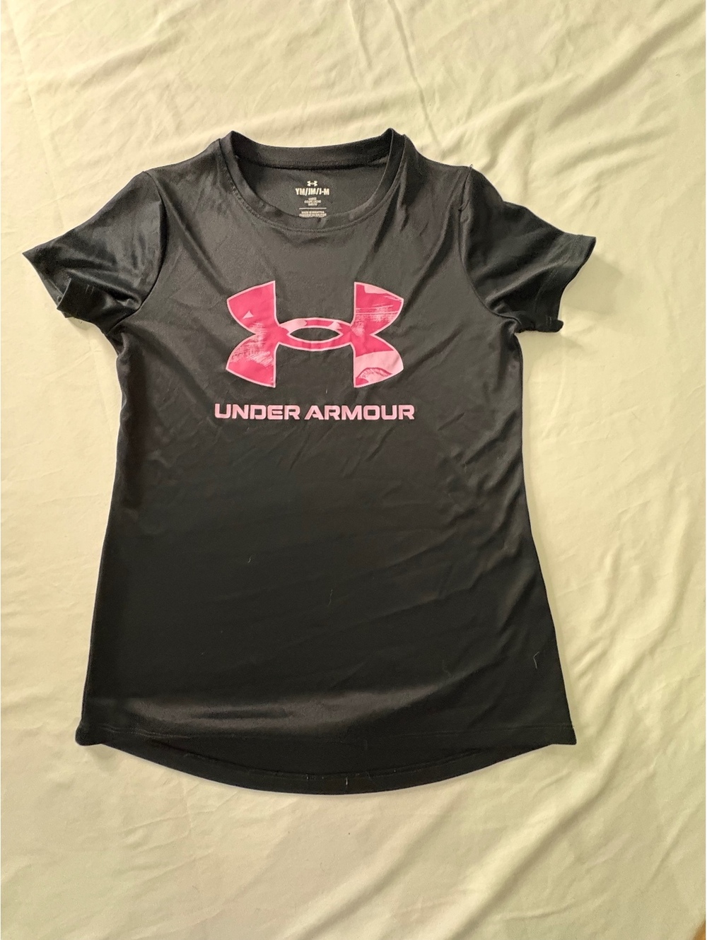 Girls Under Armour black short sleeve athletic shirt with pink logo